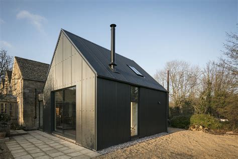 black corrugated metal small house|tiny homes with black background.